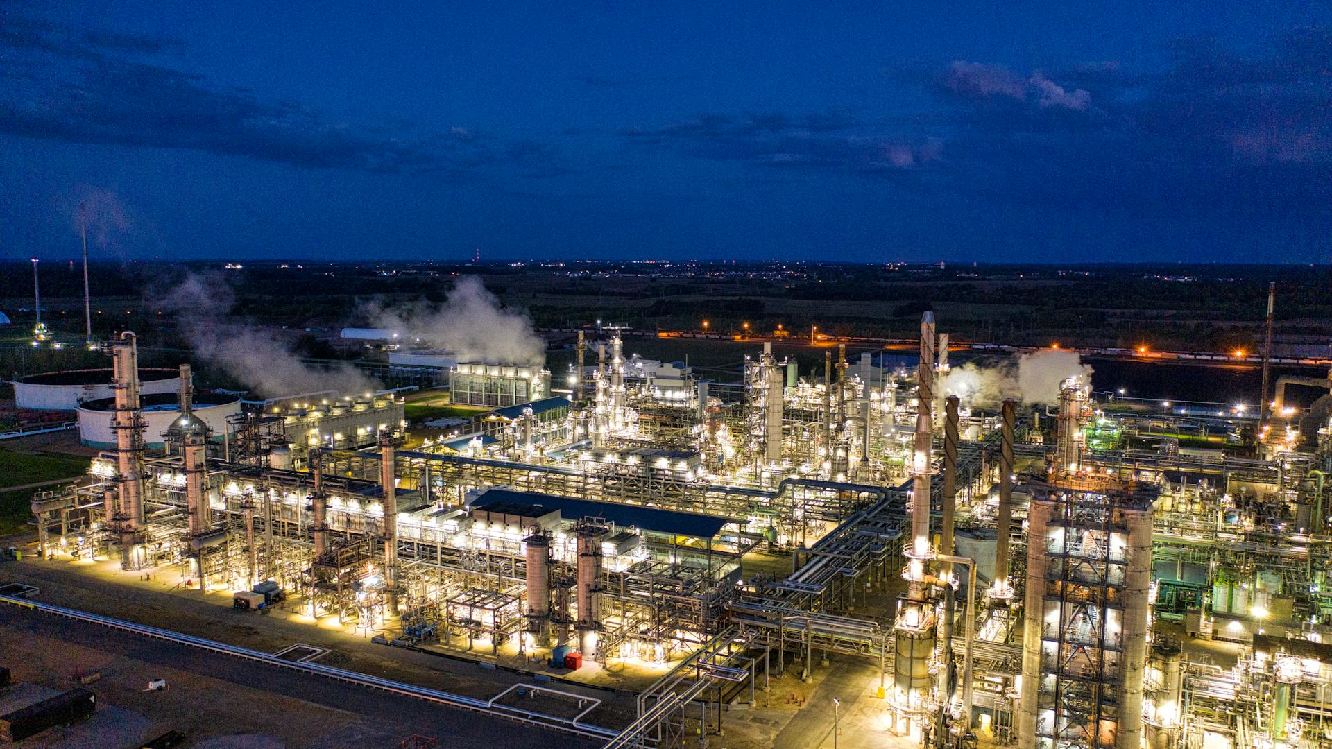 Oil refinery illuminated at night