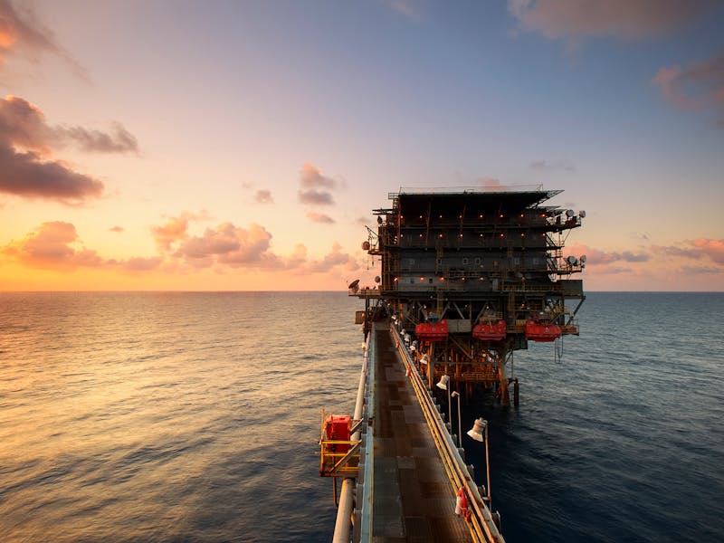 Offshore drilling platform at sunset